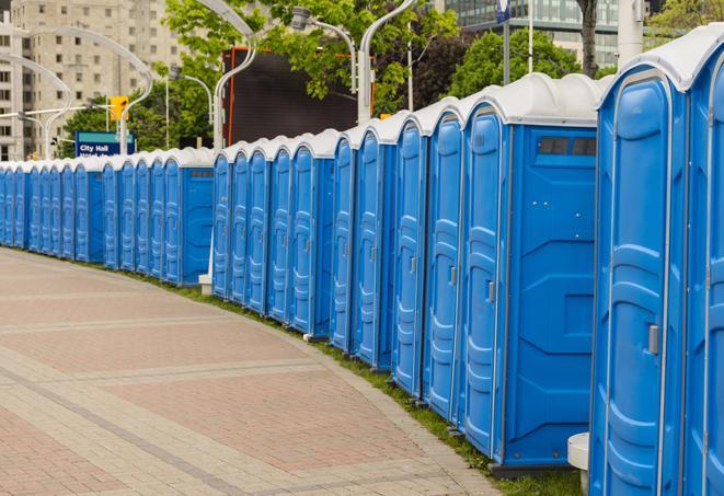 a row of sleek and modern portable restrooms at a special outdoor event in Fall River MA